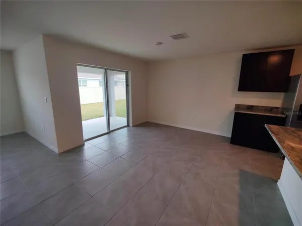 a view of an empty room with a flat screen tv