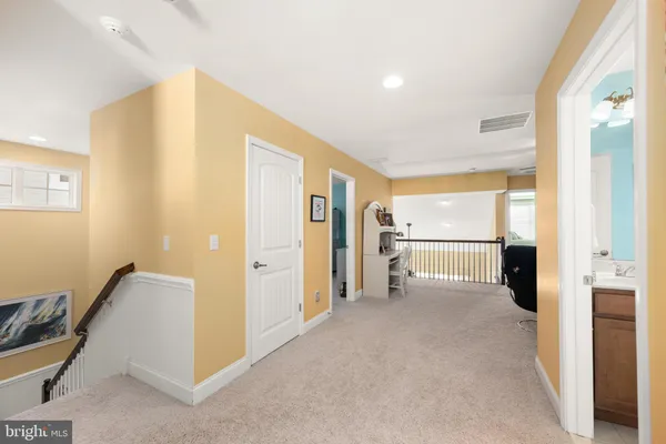 a view of a livingroom with furniture and a flat screen tv