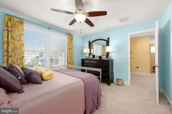 a bed room with furniture and a wooden floor