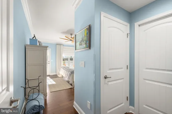 a spacious bedroom with a bed and a chandelier