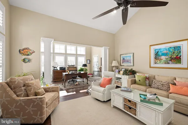 a living room with furniture or couch and a large window