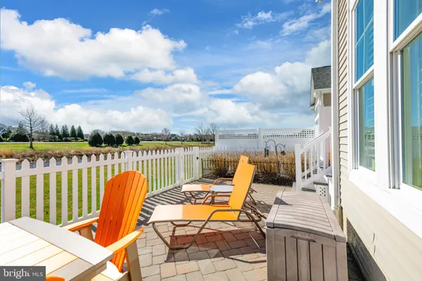 a view of a balcony with lake view and wooden floor