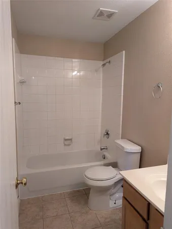 a bathroom with a toilet a sink and a shower