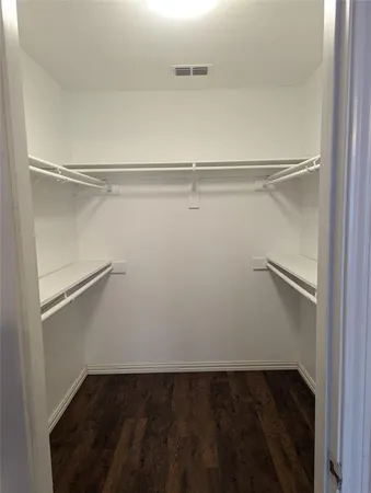 a view of an empty walk in closet