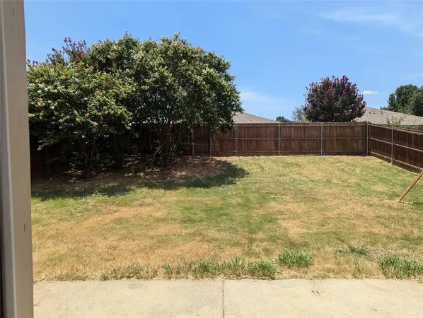 a swimming pool with trees in the background