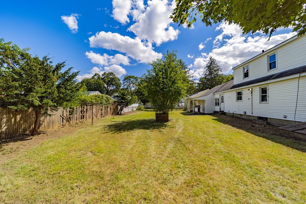 61 Davis Street Springfield, MA 01104 - Photo 6 of 28 a view of a house with a yard