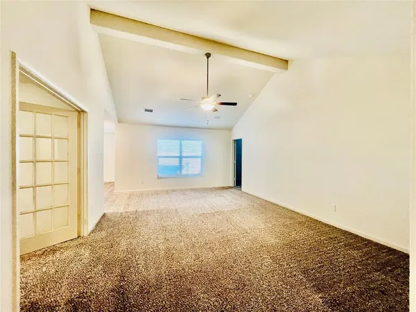 view of a big room with closet and windows