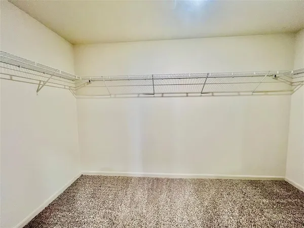 a view of a room with racks on the wall
