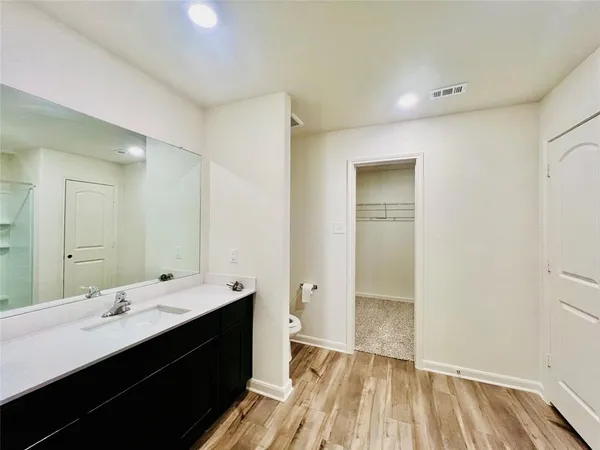 a bathroom with a double vanity sink and mirror