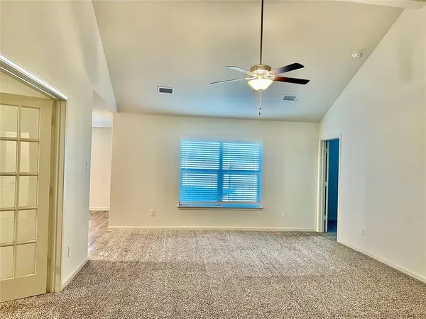 a view of an empty room with a window