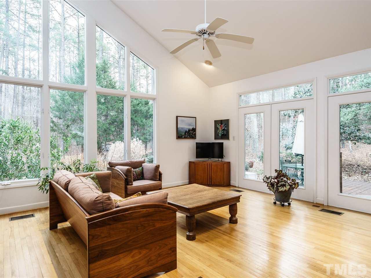 371 River Road Pittsboro, NC 27312 - Photo 3 of 25 The impressive family room has a vaulted ceiling and lots of natural light.