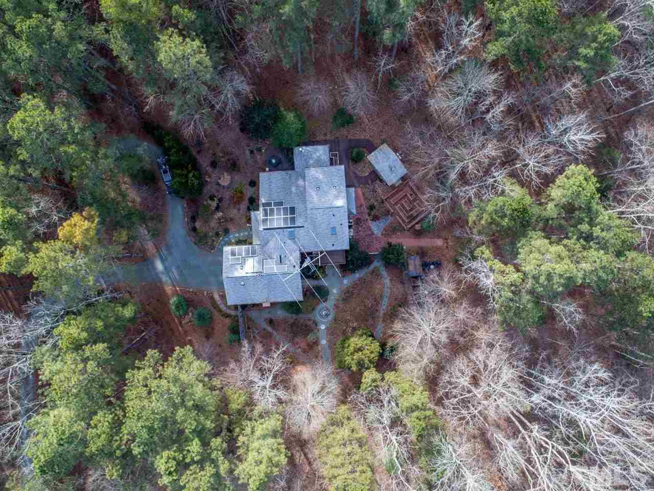 371 River Road Pittsboro, NC 27312 - Photo 21 of 25 This lovely property has a 2-car garage with gas heater, garage bathroom, 2nd laundry and workshop with custom built-ins. The sellers thought of everything when they designed this home.