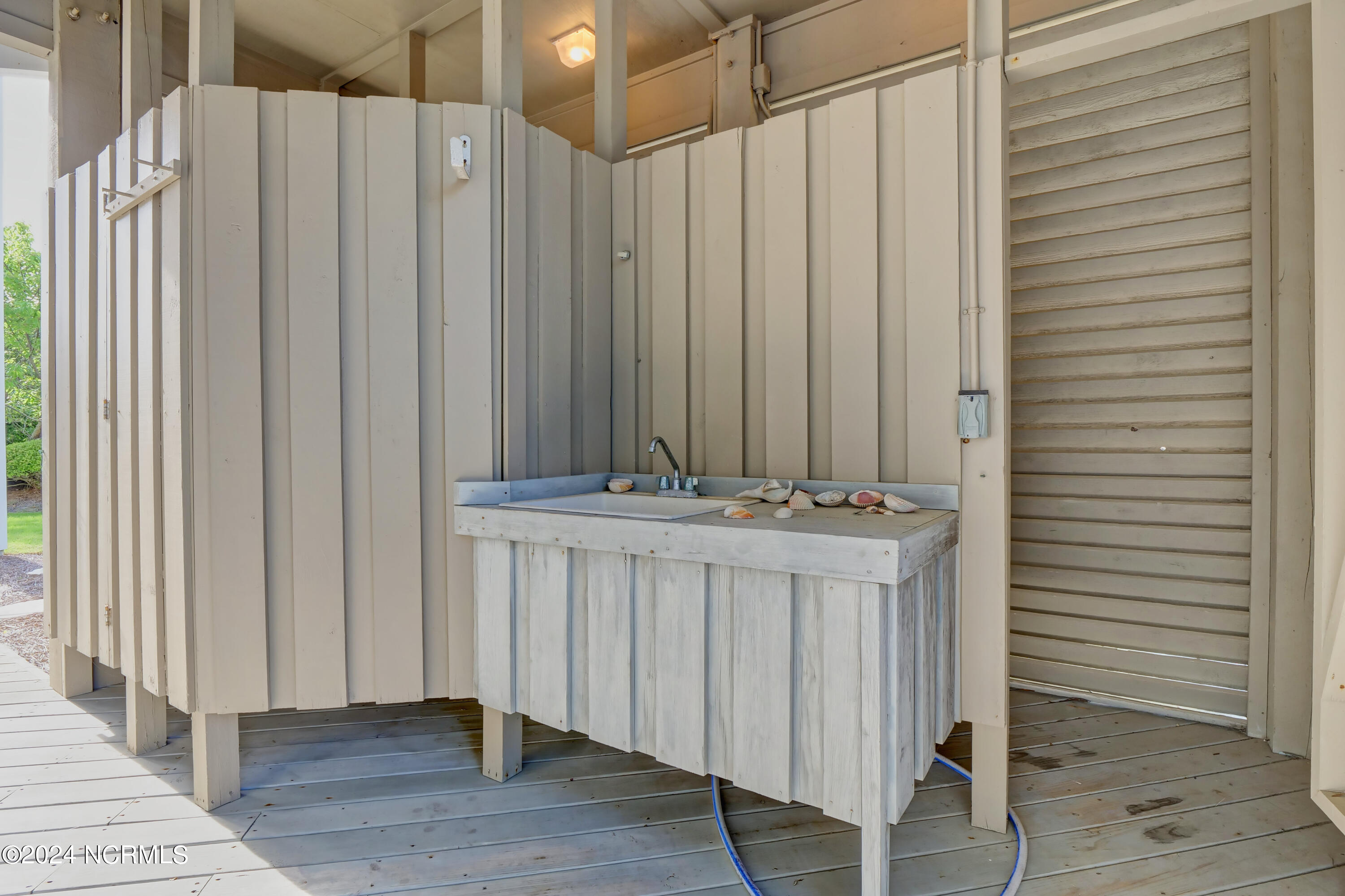 23 Comber Road Wilmington, NC 28411 - Photo 37 of 48 Outdoor Showers and laundry sink