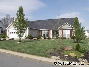 249 Planters Creek Road Fletcher, NC 28732 - Photo 1 of 12 a front view of a house with a yard