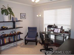 249 Planters Creek Road Fletcher, NC 28732 - Photo 12 of 12 a view of a workspace with furniture and a potted plant