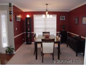 249 Planters Creek Road Fletcher, NC 28732 - Photo 3 of 12 a kitchen with a dining table and chairs
