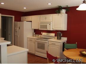249 Planters Creek Road Fletcher, NC 28732 - Photo 5 of 12 a view of a kitchen with stove and refrigerator