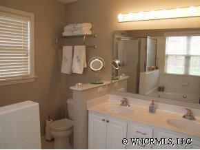 249 Planters Creek Road Fletcher, NC 28732 - Photo 9 of 12 a bathroom with a sink a toilet and mirror