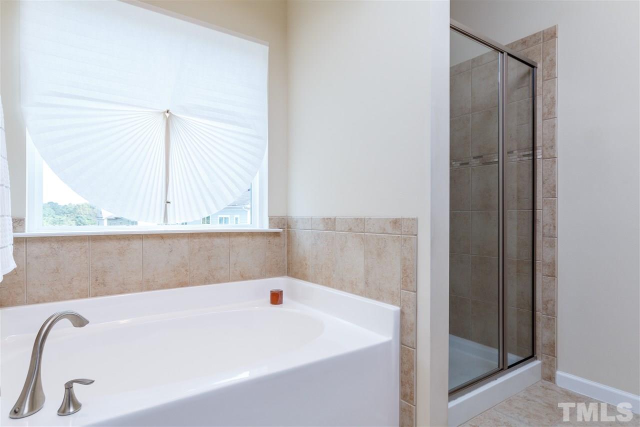 1305 Rodessa Run Raleigh, NC 27607 - Photo 18 of 25 Enjoy this master bathroom with garden tub, walk in shower, double sinks.
