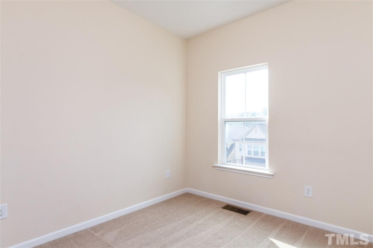 1305 Rodessa Run Raleigh, NC 27607 - Photo 23 of 25 You'll love this home as it has so much space and so many bedrooms! Another secondary bedroom upstairs including a closet.