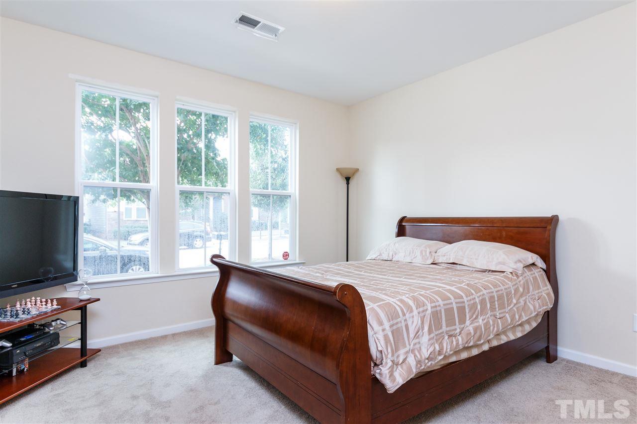1305 Rodessa Run Raleigh, NC 27607 - Photo 4 of 25 Enjoy the spacious bedroom on the first floor of the home with beautiful natural light.