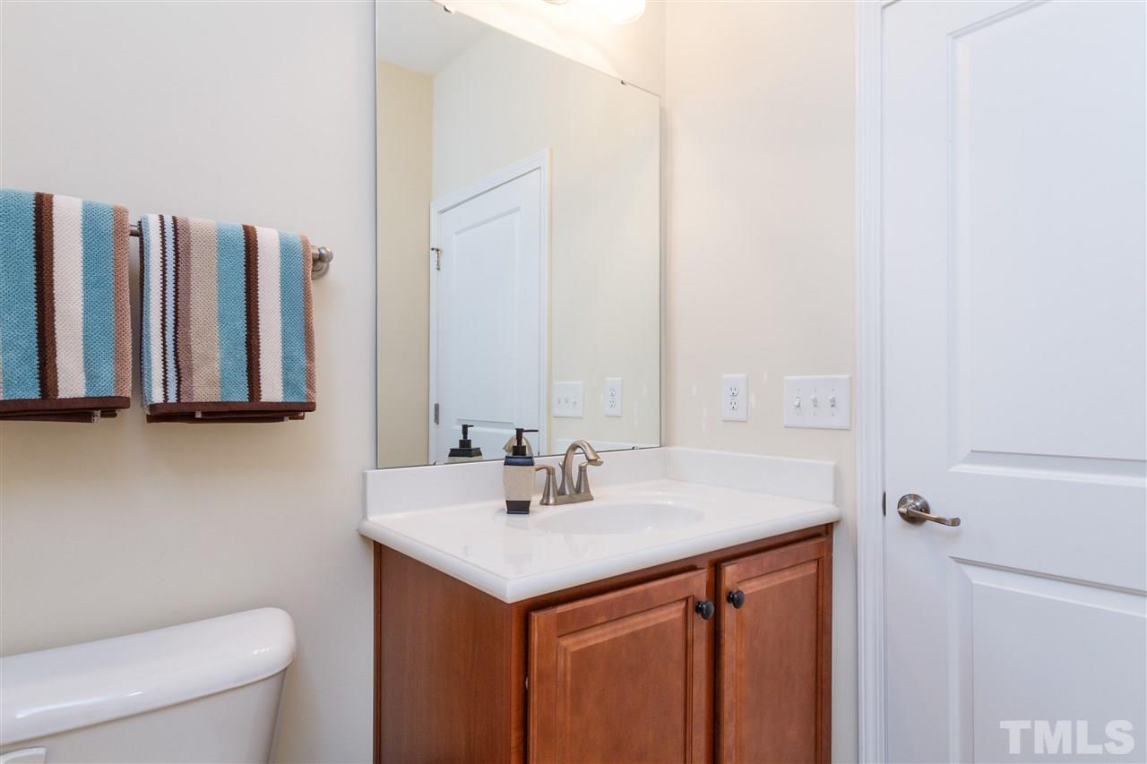 1305 Rodessa Run Raleigh, NC 27607 - Photo 5 of 25 Full bath next to the downstairs bedroom creates a private space, could be used as a guest suite or home office.