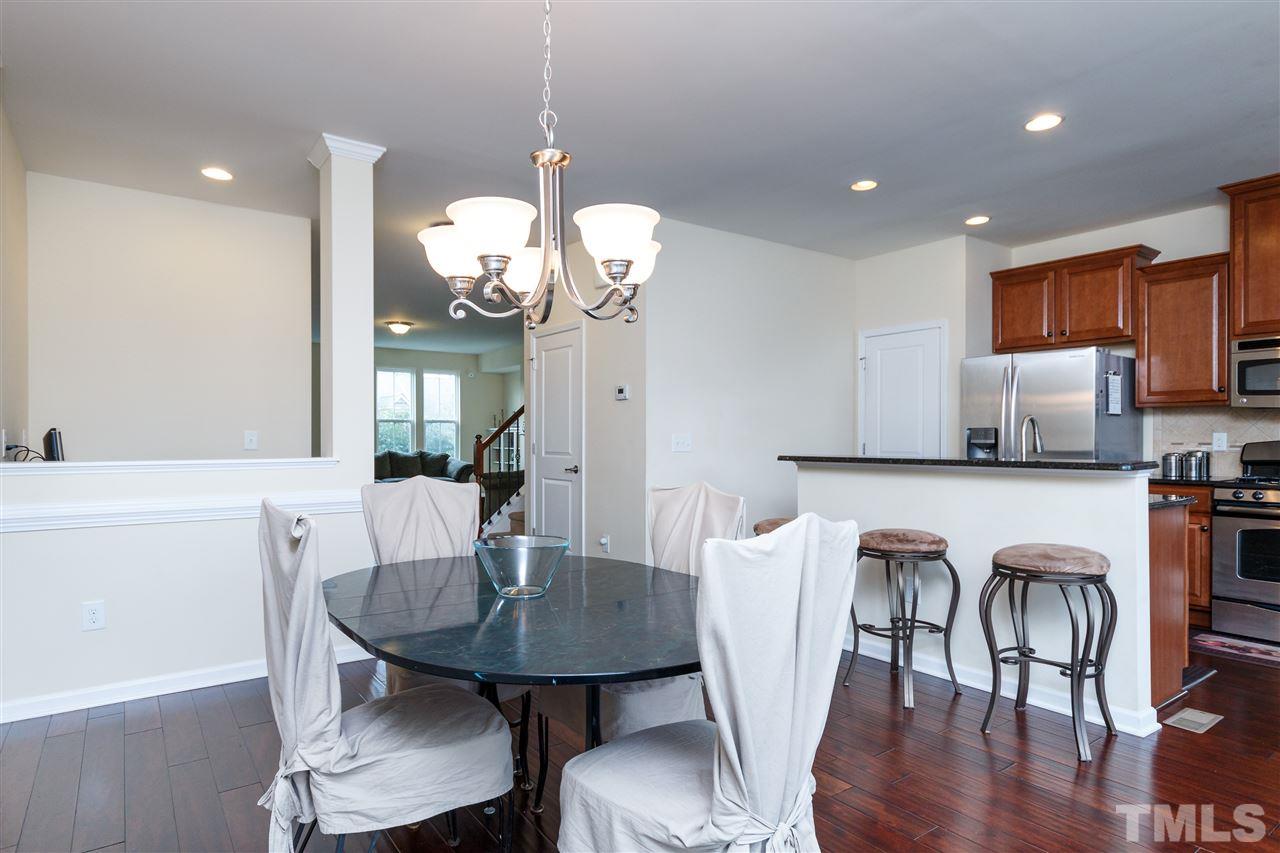 1305 Rodessa Run Raleigh, NC 27607 - Photo 10 of 25 Dining room is open to kitchen with extra seating at the bar as well.