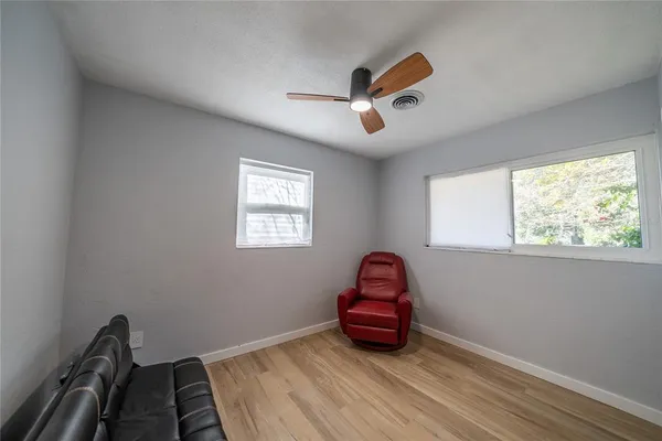 a view of empty room with sliding windows