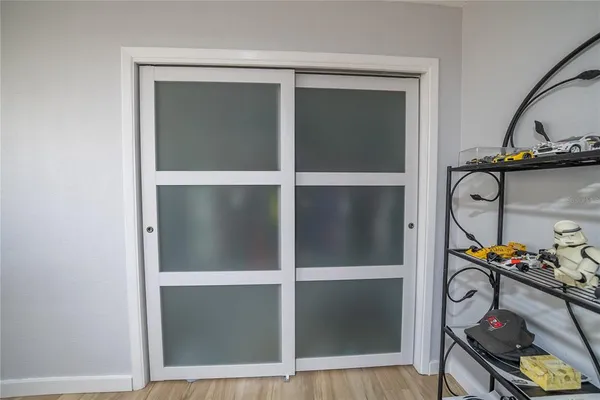 an aerial view of a house with yard and large trees