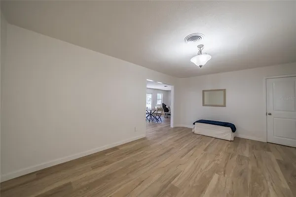 a large kitchen with stainless steel appliances granite countertop a stove a sink dishwasher and a oven with wooden cabinets