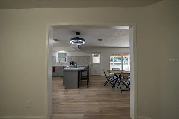 a view of a livingroom with furniture window and wooden floor