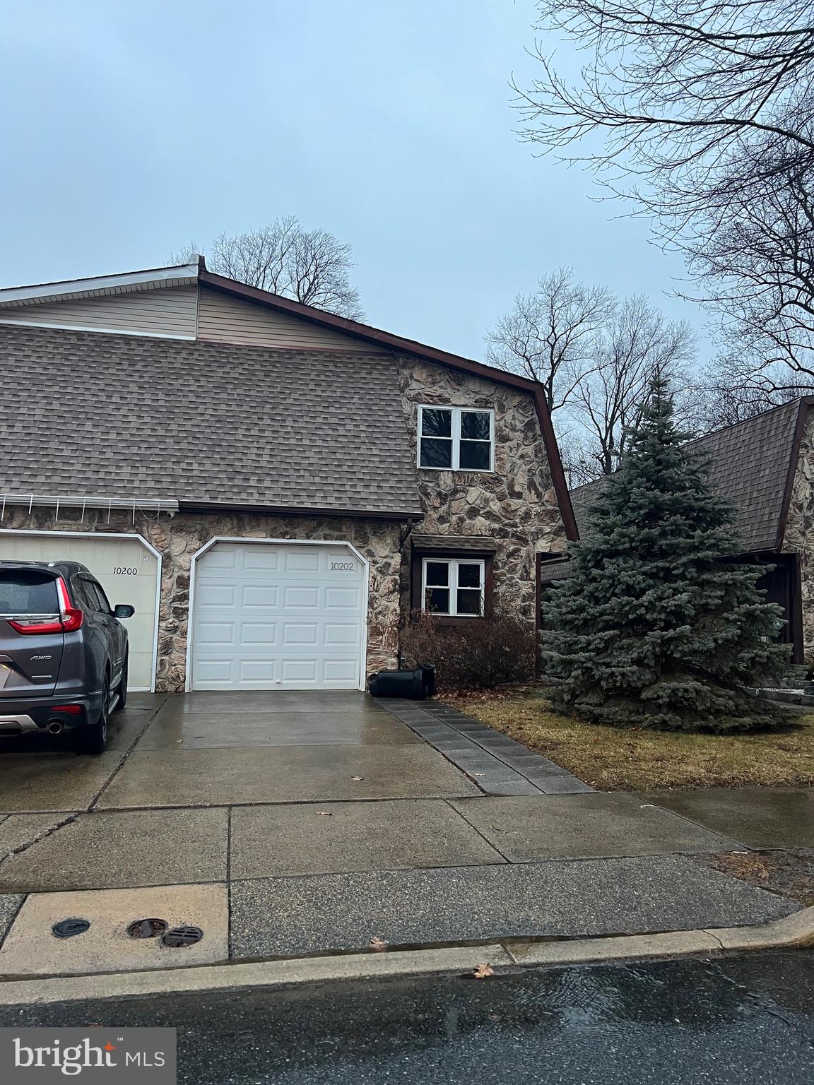 a front view of a house with garage