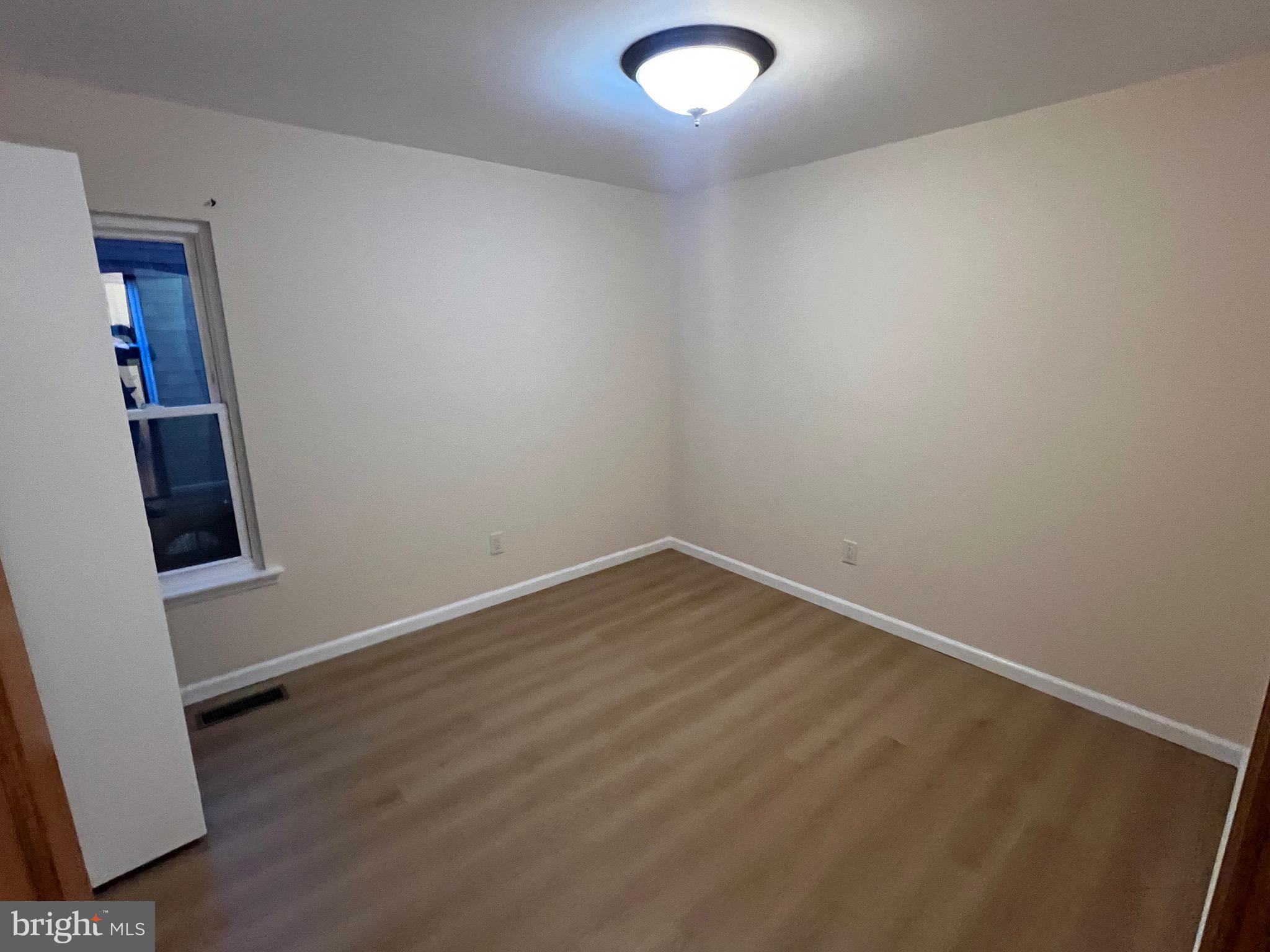 10202 Murty Lane Philadelphia, PA 19116 - Photo 5 of 8 an empty room with a door