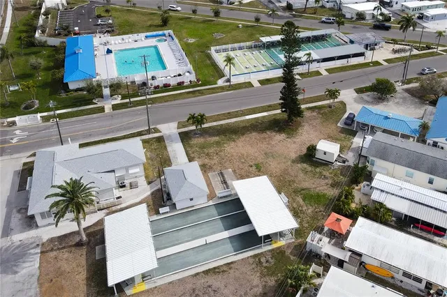 an aerial view of a house with garden space and street view