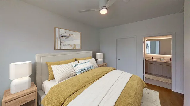 a bedroom with a bed and lamp