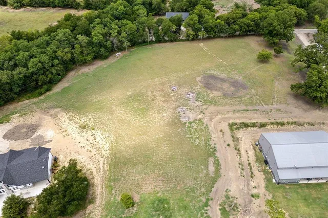 a view of a lake with houses in the back