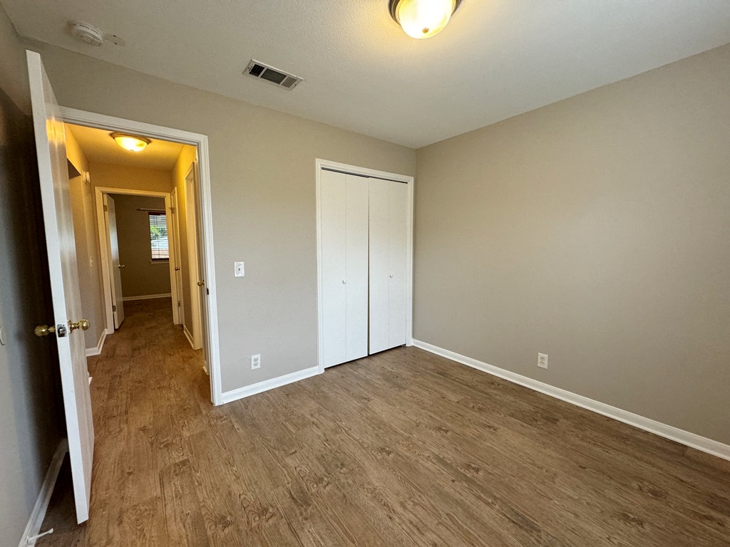 219 Crystal Knoll Boulevard Georgetown, TX 78626 - Photo 17 of 32 wooden floor in an empty room with a window
