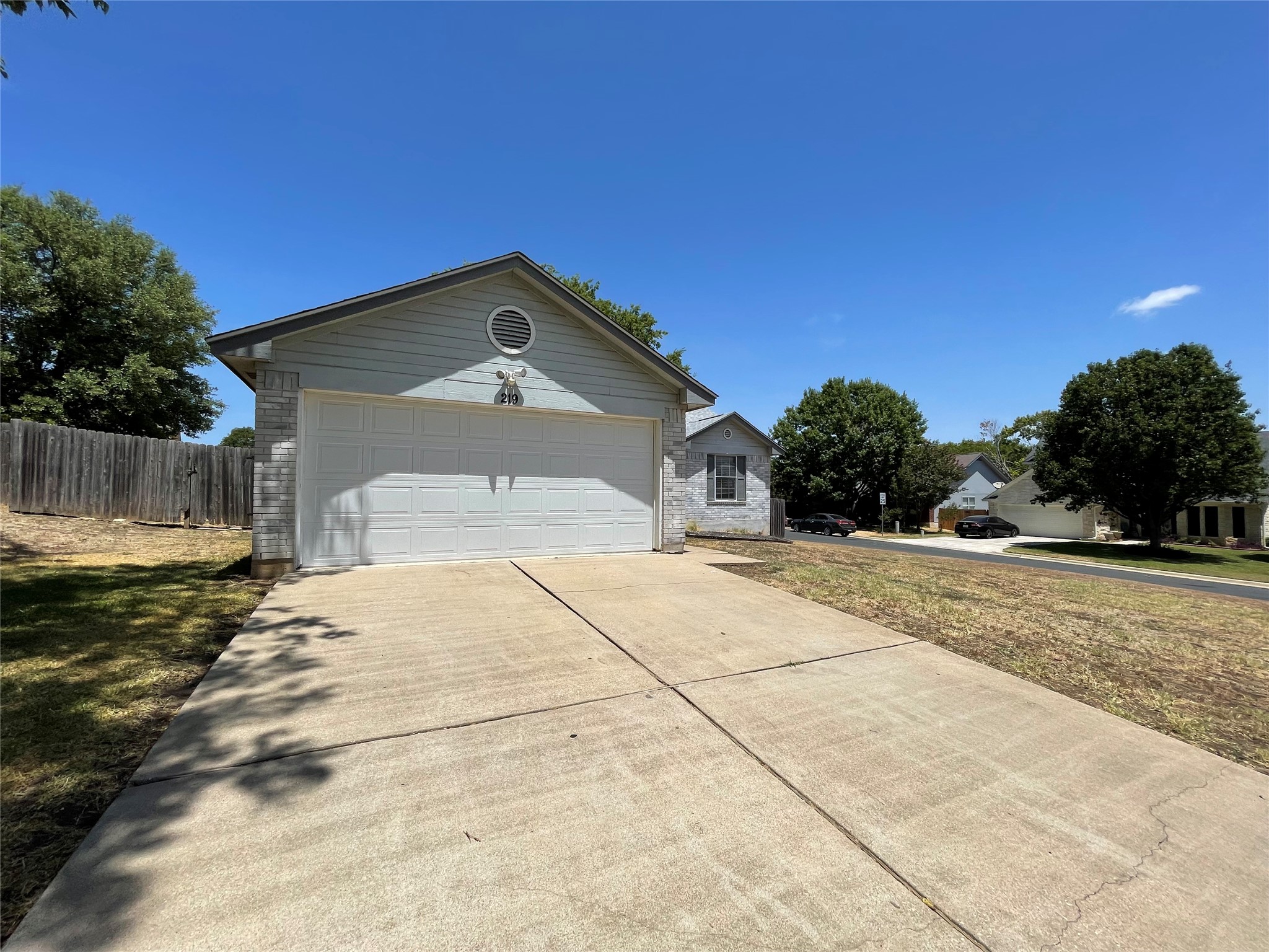 219 Crystal Knoll Boulevard Georgetown, TX 78626 - Photo 2 of 32 a front view of a house with a yard