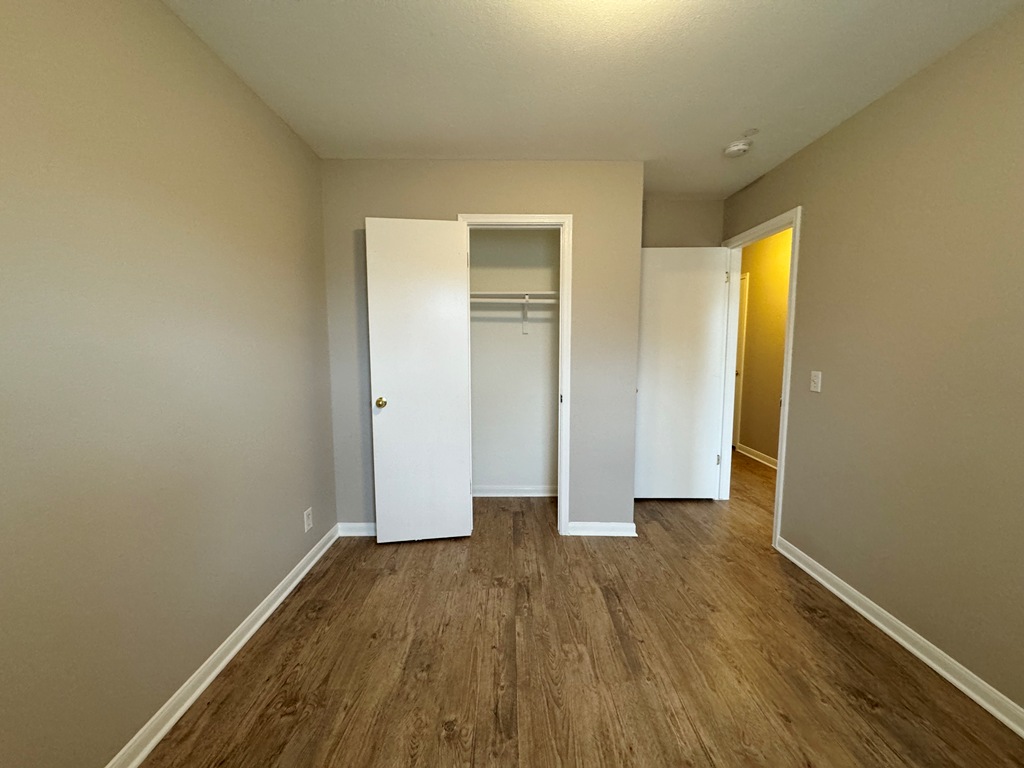 219 Crystal Knoll Boulevard Georgetown, TX 78626 - Photo 23 of 32 an empty room with wooden floor and closet
