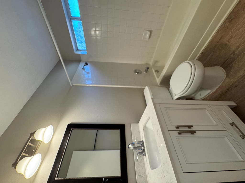 219 Crystal Knoll Boulevard Georgetown, TX 78626 - Photo 26 of 32 a bathroom with a toilet a sink a tub and mirror