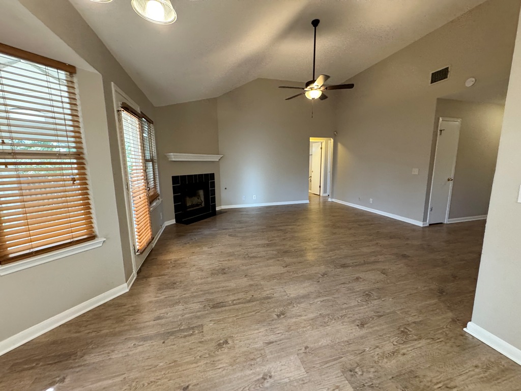 219 Crystal Knoll Boulevard Georgetown, TX 78626 - Photo 3 of 32 an empty room with windows and fireplace