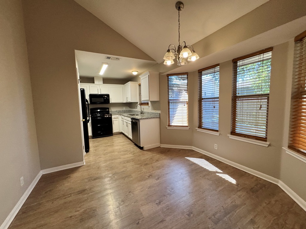 219 Crystal Knoll Boulevard Georgetown, TX 78626 - Photo 5 of 32 a view of a kitchen with a stove cabinets and wooden floor