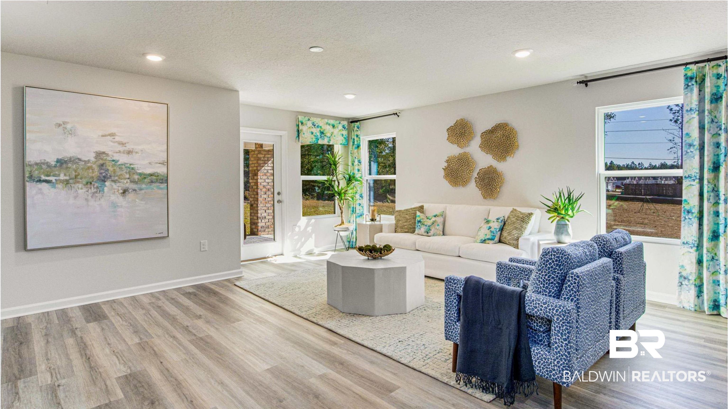 1040 Hayward Loop Foley, AL 36535 - Photo 12 of 35 Spacious living area featuring wood-finish flooring, recessed lighting, and ample natural illumination from multiple windows