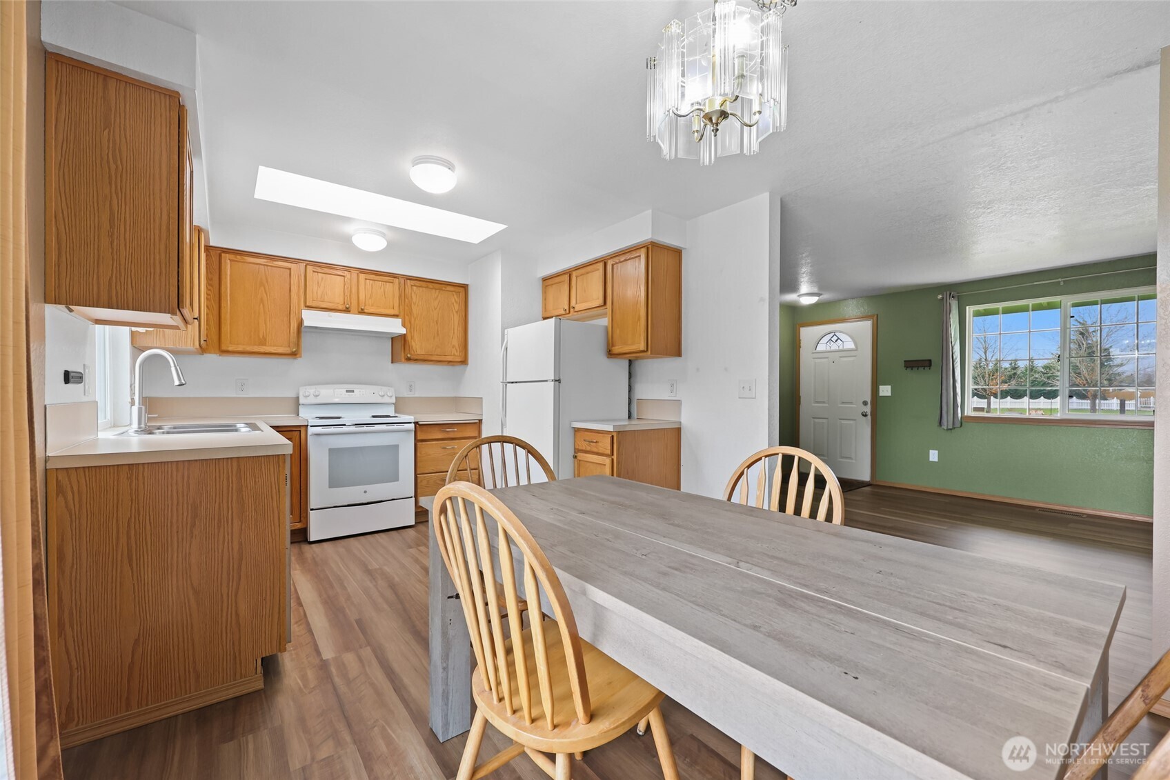 17932 Camus Drive Southwest Rochester, WA 98579 - Photo 12 of 28 a view of a dining room with furniture and wooden floor