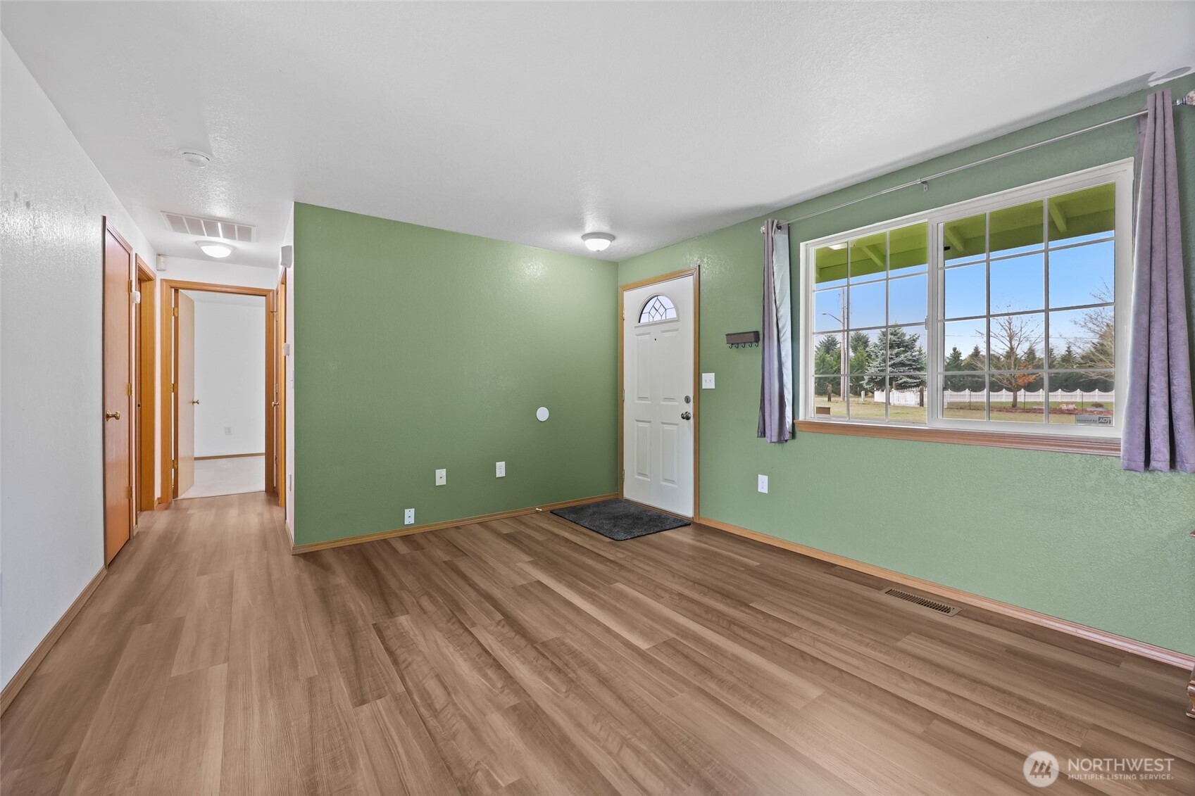 17932 Camus Drive Southwest Rochester, WA 98579 - Photo 13 of 28 a view of a room with wooden floor and windows