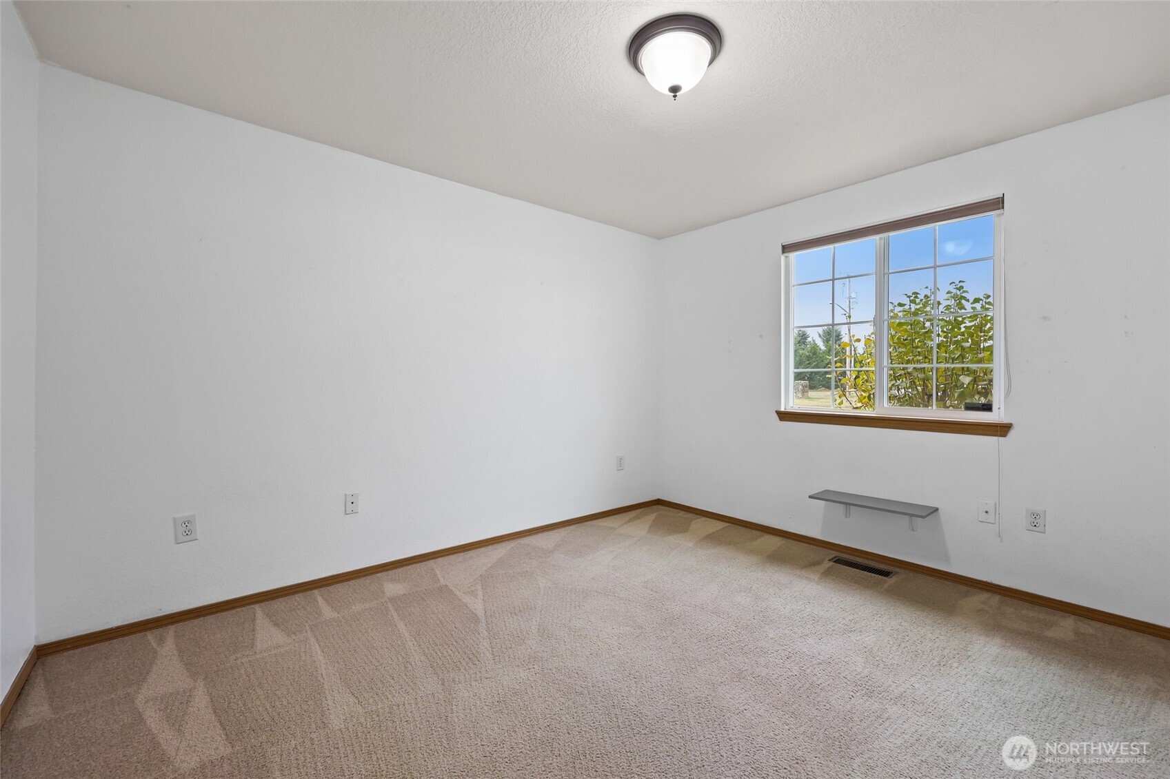 17932 Camus Drive Southwest Rochester, WA 98579 - Photo 16 of 28 an empty room with a window
