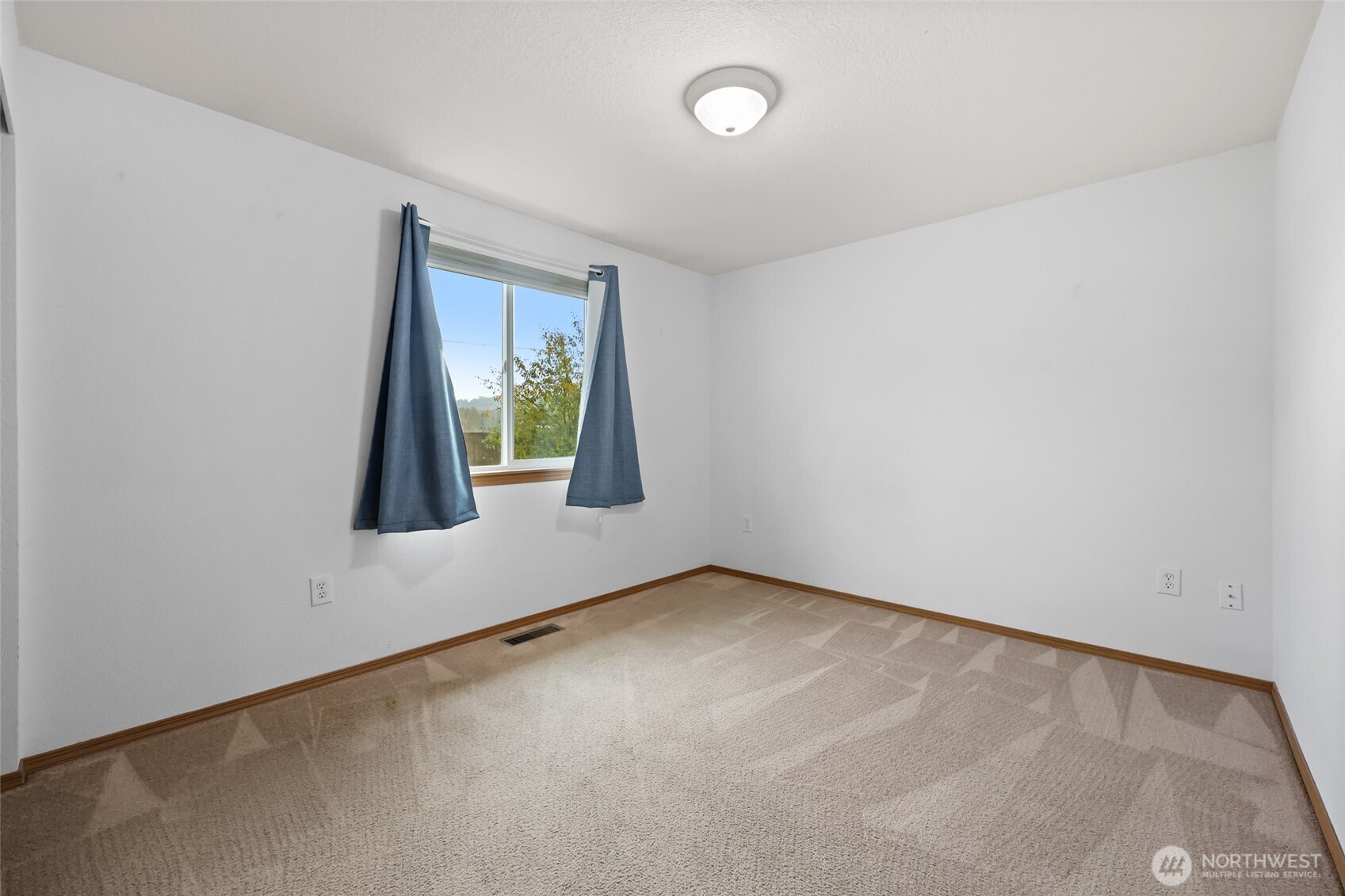 17932 Camus Drive Southwest Rochester, WA 98579 - Photo 18 of 28 an empty room with windows