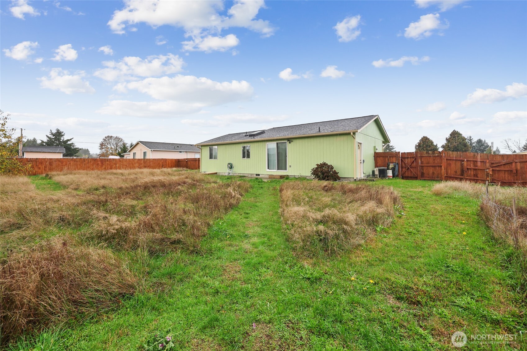 17932 Camus Drive Southwest Rochester, WA 98579 - Photo 24 of 28 a backyard of a house with table and chairs