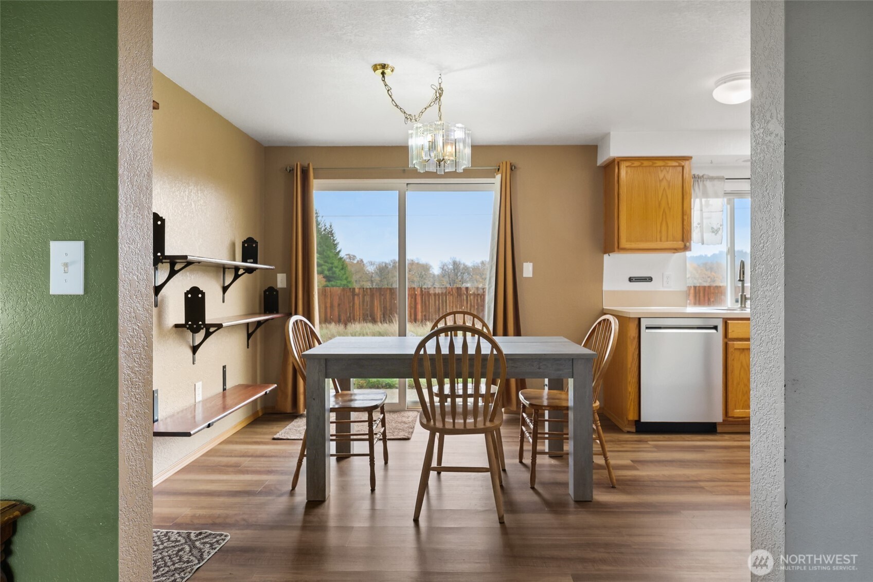 17932 Camus Drive Southwest Rochester, WA 98579 - Photo 7 of 28 a view of a dining room with furniture window and wooden floor