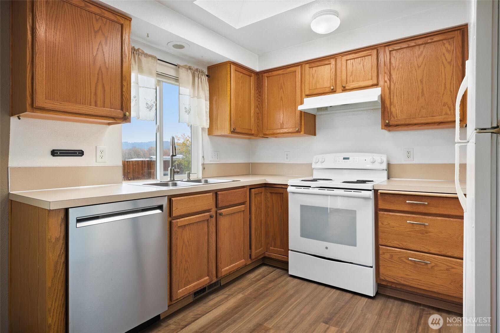 17932 Camus Drive Southwest Rochester, WA 98579 - Photo 10 of 28 a kitchen with stainless steel appliances granite countertop a sink stove and cabinets